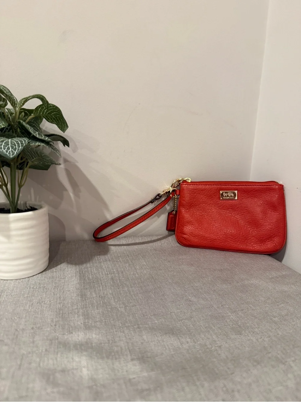 Coach Coral Leather Wristlet with Gold Plaque